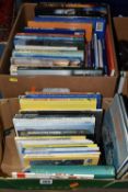 TWO BOXES OF BOOKS containing approximately fifty titles in hardback and paperback formats on the