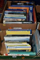 TWO BOXES OF BOOKS containing approximately fifty titles in hardback and paperback formats on the