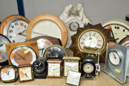 A LARGE QUANTITY OF MID-CENTURY CLOCKS, comprising twenty five clocks and two barometers, five