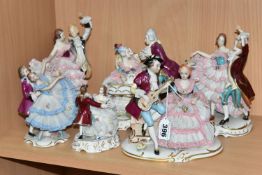 SIX DRESDEN FIGURE GROUPS, each figure in a porcelain lace effect dress or with lace cuffs and shirt