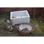 A WHITE GLAZED BELFAST SINK, a shaped composite planter and a section of a water fountain