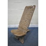 AN AFRICAN CARVED HARDWOOD BIRTHING CHAIR (condition report: comes into two pieces, small chip to