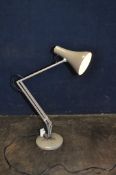 AN ANGLEPOISE STYLE ARTICULATED LAMP in beige (PAT pass and working) (Condition some paint losses)