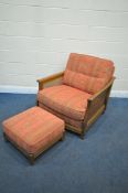 AN ERCOL ELM AND BEGERE ARMCHAIR, with floral fabric, and a matching footstool (condition report: