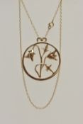 A 9CT GOLD OPEN WORK FLORAL NECKLACE, a large yellow gold circular pendant with an arrangement of