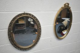 TWO GILT FRAMED OVAL WALL MIRRORS (condition report: small chip to one mirror)