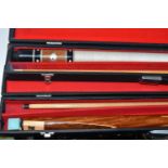 TWO CASED SNOOKER CUES, comprising a two section Ray Reardon cue in a ADAC case and an unbranded '