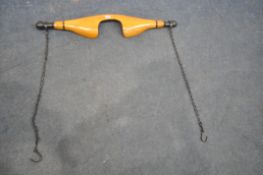 A WOOD AND METAL MILK MAIDS SHOULDER YOKE, complete with chains and hooks, length 92cm (