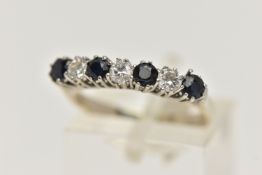 AN 18CT WHITE GOLD DIAMOND AND SAPPHIRE RING, designed as a row of four circular sapphires