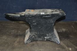 A VERY HEAVY CAST METAL ANVIL, length 57cm x depth 13cm x height 30cm, with a bespoke made stand