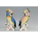 TWO KARL ENS PORCELAIN COCKATOOS, each modelled perched on a branch, and glazed in pastel pinks,