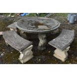 A RECONSTITUTED STONE FIVE PIECE GARDEN SUITE, comprising a circular table that rests on three