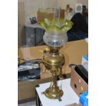 AN ARTS & CRAFTS BRASS AND COPPER OIL LAMP IN THE STYLE OF W.A.S. BENSON, the frilled green and
