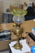 AN ARTS & CRAFTS BRASS AND COPPER OIL LAMP IN THE STYLE OF W.A.S. BENSON, the frilled green and