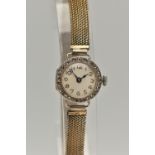 AN EARLY 20TH CENTURY LADYS 18CT GOLD AND DIAMOND WRISTWATCH, manual wind, round white dial,