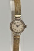 AN EARLY 20TH CENTURY LADYS 18CT GOLD AND DIAMOND WRISTWATCH, manual wind, round white dial,