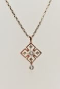 AN EARLY 20TH CENTURY ART DECO PENDANT, a rose gold quatrefoil open work pendant, principally set