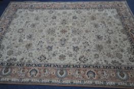 A LARGE WOOL CREAM AND PINK RUG, 306cm x 202cm (condition report: in need of cleaning, full of dog
