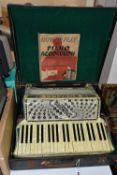 A SIGNORA BOSELLI ITALIA Piano Accordion in a case with a 'How To Play the Piano Accordeon' book