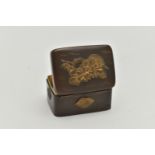 A JAPANESE MEIJI PERIOD BRONZED AND GILT METAL PILL BOX, gilt relief decoration to top and sides,