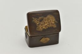 A JAPANESE MEIJI PERIOD BRONZED AND GILT METAL PILL BOX, gilt relief decoration to top and sides,