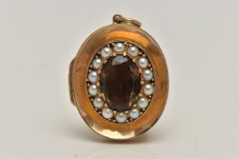 A 9CT GOLD SMOKY QUARTZ AND SPLIT PEARL LOCKET, concaved locket principally set with an oval cut