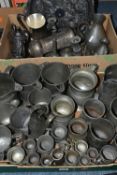 TWO BOXES OF METAL WARES, MOSTLY PEWTER, to include measuring jugs stamped with a VR monogram,