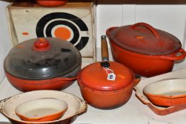 A GROUP OF CAST IRON AND STONEWARE COOKWARE, thirteen pieces to include boxed Le Creuset and other