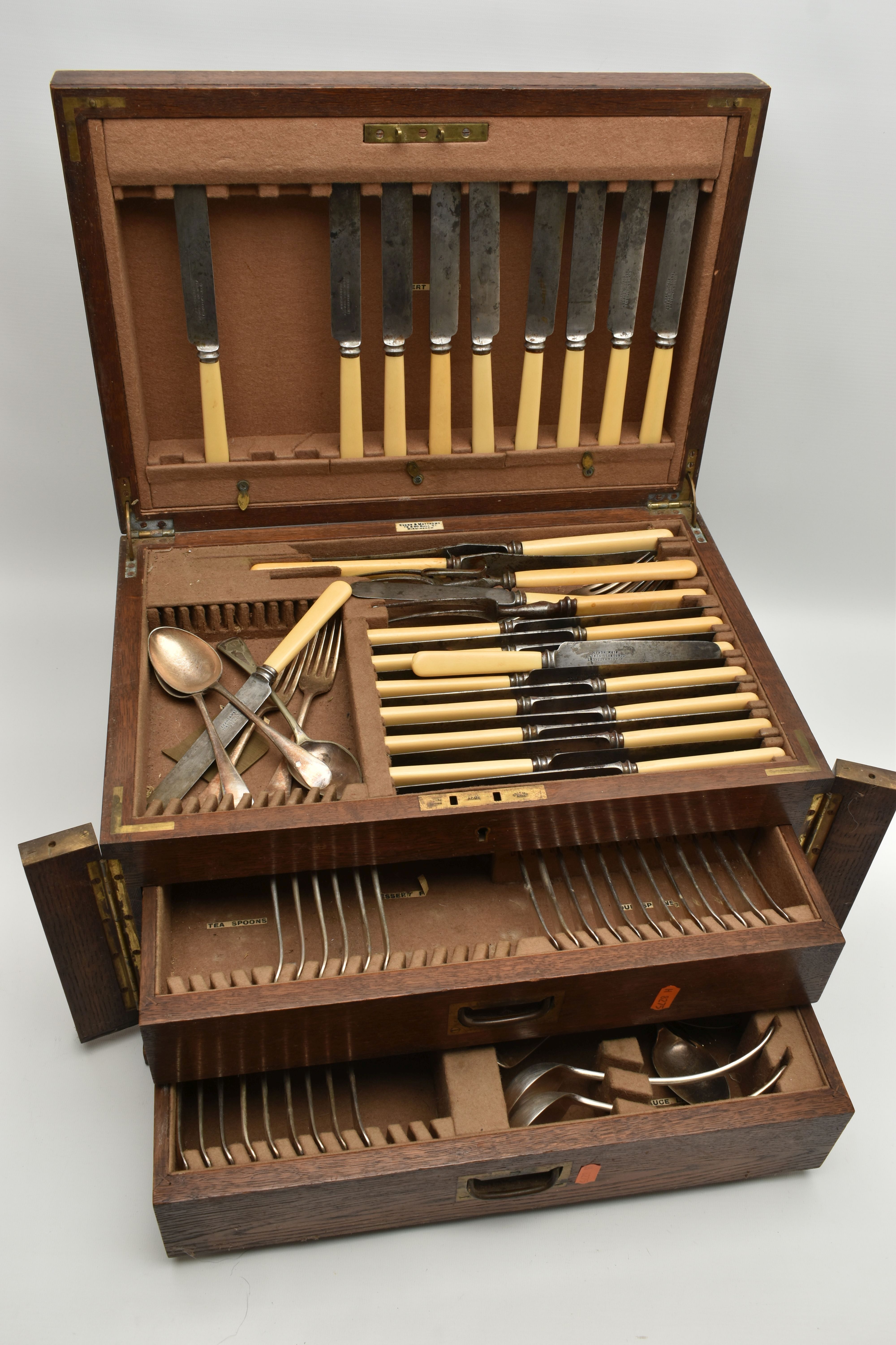 A LARGE WOODEN CANTEEN, box signed 'Evans & Matthews', incomplete ivorine handled cutlery set