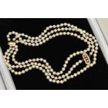 AN 18CT GOLD CULTURED PEARL CHOKER NECKLACE, three strand cultured pearl choker necklace with a