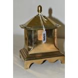 A BRASS BOX WITH COVER, possibly a tea caddy, of architectural form, standing on four brass legs,