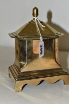 A BRASS BOX WITH COVER, possibly a tea caddy, of architectural form, standing on four brass legs,