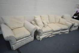 A FLORAL CREAM THREE PIECE LOUNGE SUITE, comprising a three seater settee, 230cm x depth 100cm x