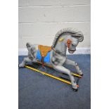 A PLASTIC ROCKING HORSE (condition report: missing base)