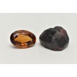 TWO LOOSE GEMSTONES, to include a loose oval cut citrine and a rough garnet