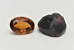 TWO LOOSE GEMSTONES, to include a loose oval cut citrine and a rough garnet