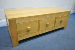 A LIGHT OAK COFFEE TABLE, with six drawers, width 118cm x depth 56cm x height 43cm (condition