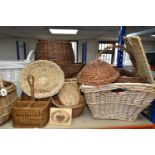 A LARGE QUANTITY OF WICKER BASKETS AND HAMPERS, comprising shopping baskets, linen baskets, picnic