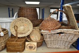A LARGE QUANTITY OF WICKER BASKETS AND HAMPERS, comprising shopping baskets, linen baskets, picnic