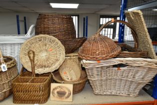 A LARGE QUANTITY OF WICKER BASKETS AND HAMPERS, comprising shopping baskets, linen baskets, picnic