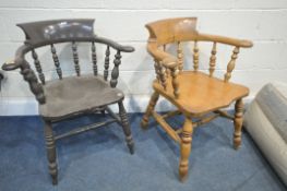 A 19TH CENTURY ELM BOW TOP SMOKERS ARMCHAIR, along with a similar stained smokers’ armchair (