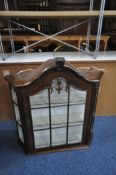 A MAHOGANY CANTED WALL MOUNTED SINGLE DOOR DISPLAY CABINET, width 68cm x depth 18cm x height 73cm (