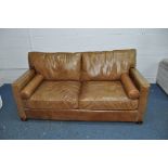 A HALO LIVING LEATHER TWO SEAT SOFA light brown in colour with two roll cushions width 182cm x depth