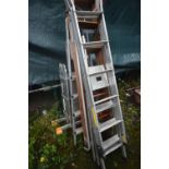 FIVE VARIOUS LADDERS, to include a workzone multi function ladder, two aluminium step ladders, a
