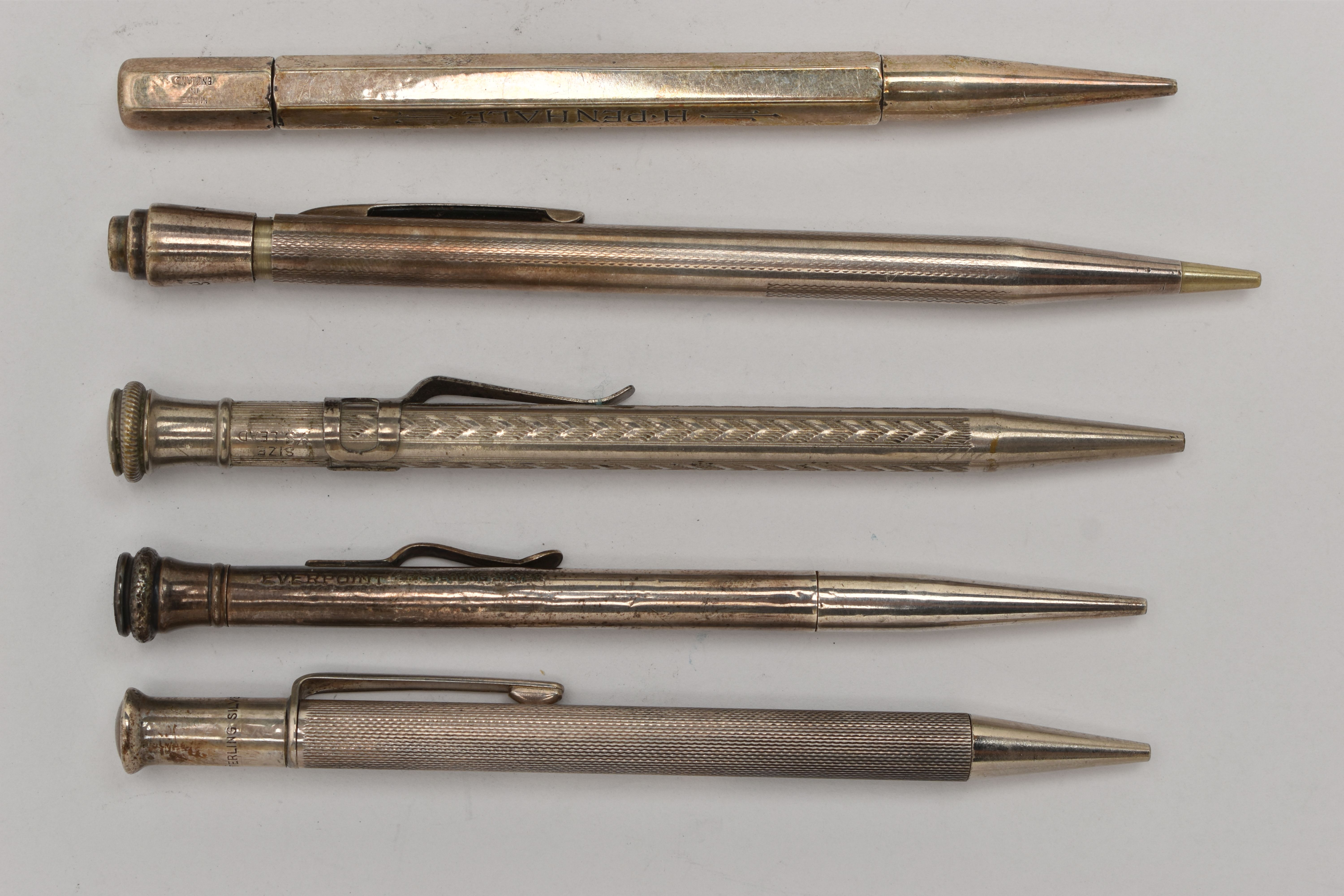 FIVE PROPELLING PENCILS, to include a silver hexagonal pencil, hallmarked 'Johnson, Matthey & Co'