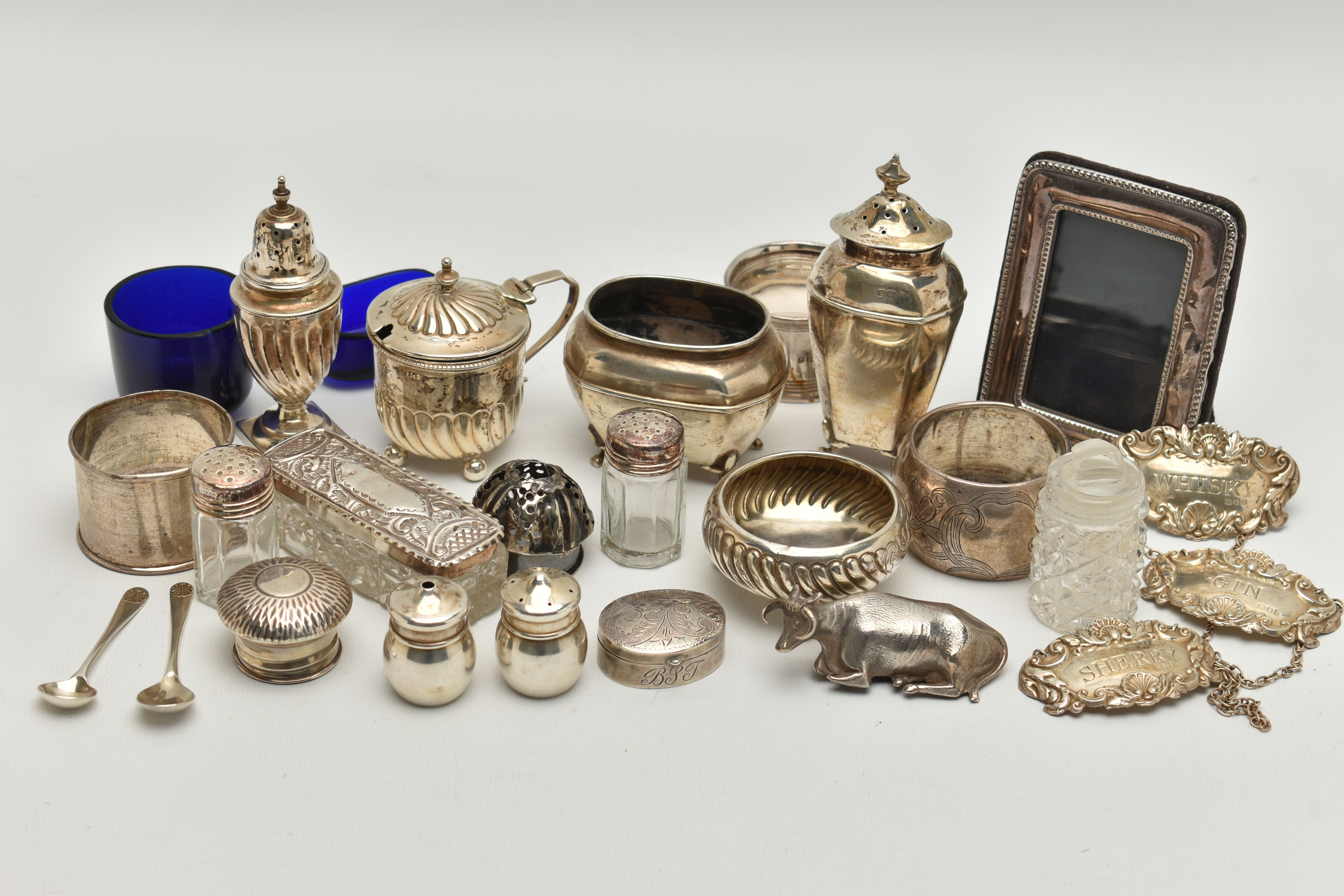 AN ASSORTED BOX OF SILVER ITEMS, to include three napkin rings, salt and pepper shakers, three