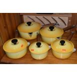 A COLLECTION OF LIDDED LE CREUSET SAUCEPANS IN 'SOLEIL YELLOW', five graduated lidded saucepans,