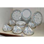 A MINTON PART TEA SET, printed and tinted with floral garlands, blue ribbon and sprays of flowers,