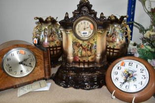 A VICTORIAN PORCELAIN CLOCK GARNITURE, comprising a brown gilt porcelain mantel clock and a brown
