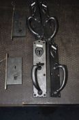 TWO PAIRS OF CAST IRON DOOR HANDLES, with thumb latch and boobbyer locking mechanism, both with
